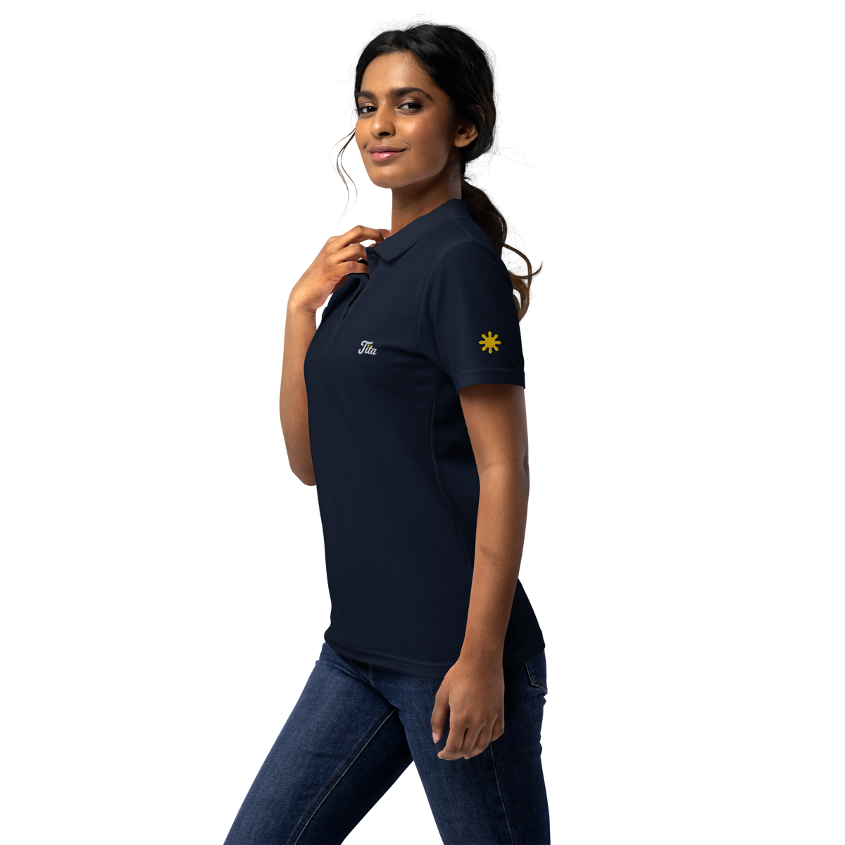 Tita (Auntie) women’s polo, Navy, model, left side with gold sun on sleeve